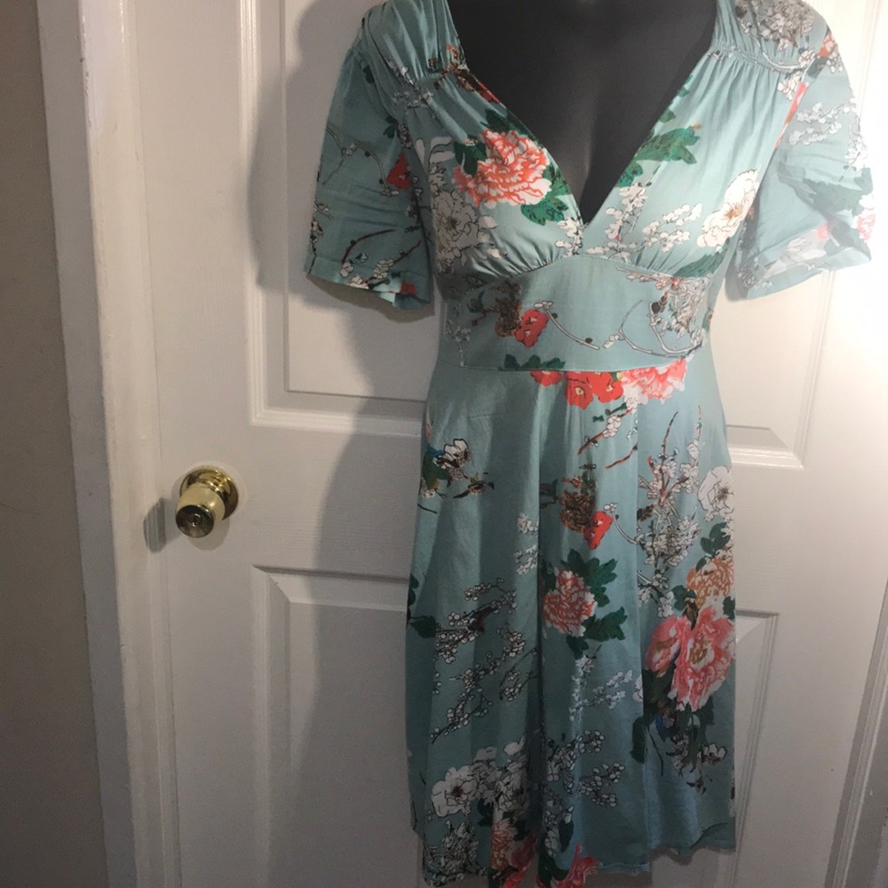 Pretty teal midi dress with floral pattern..